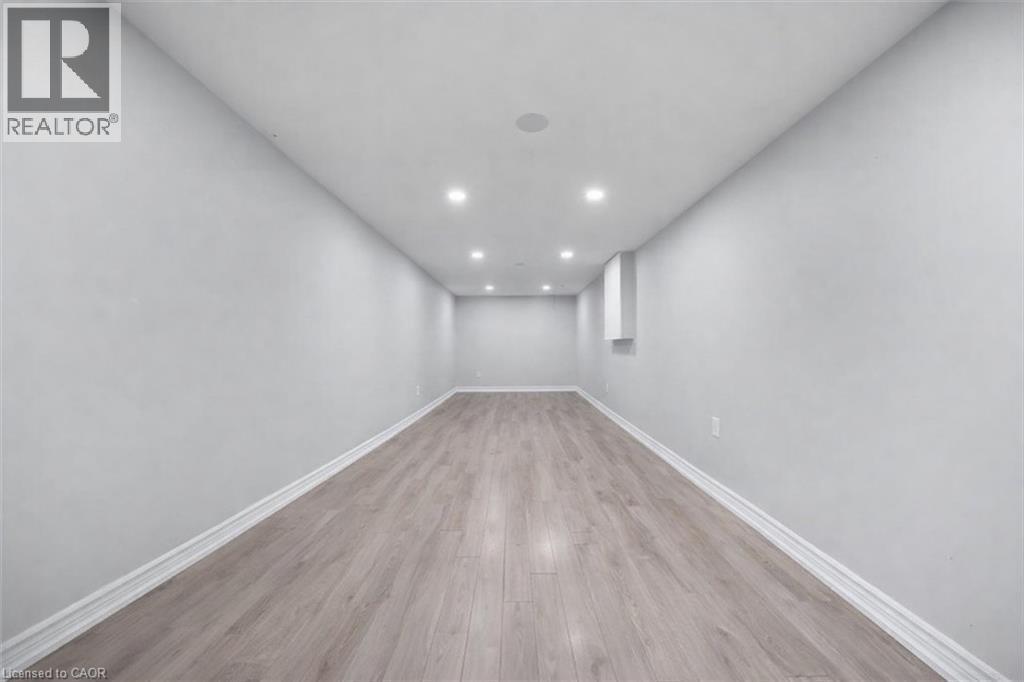 Unfurnished room with recessed lighting and light wood-style flooring - 106 Lottridge Street, Hamilton, ON - Indoor Photo Showing Other Room