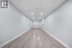 Unfurnished room with recessed lighting and light wood-style flooring -