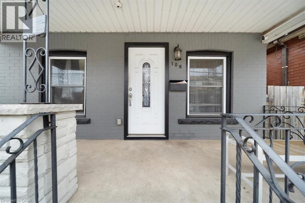 Property entrance with a porch and brick siding - 106 Lottridge Street, Hamilton, ON - Outdoor With Exterior
