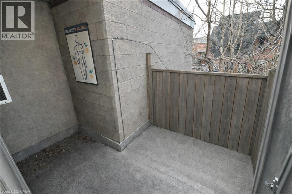 Unit 4 Patio - Image AI generated to remove Tenants belongings, Unit is similar to picture but may not be identical - Photo is for information purposes only. - 237 James Street N, Hamilton, ON