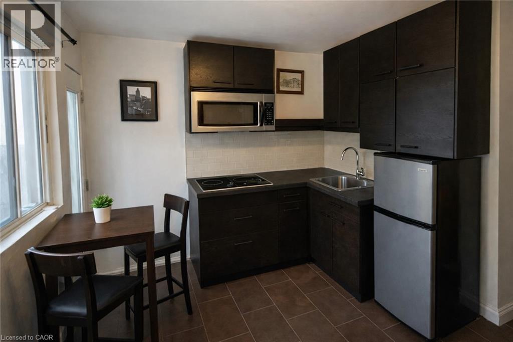 Unit 4 Kitchen/ Dinning - Image AI generated to remove Tenants belongings, Unit is similar to picture but may not be identical - Photo is for information purposes only. - 237 James Street N, Hamilton, ON