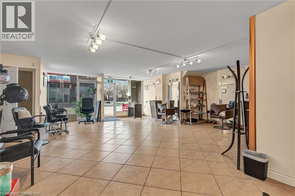 Common area featuring floor to ceiling windows - 70 Ottawa Street N, Hamilton, ON - Indoor Photo Showing Other Room
