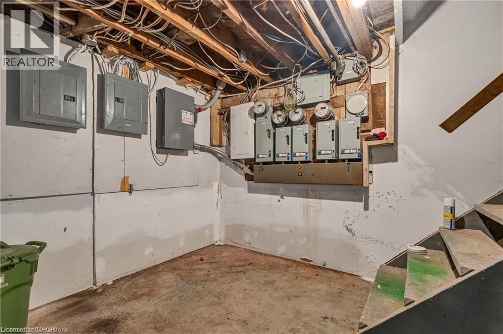 Utility room featuring electric panel - 70 Ottawa Street N, Hamilton, ON - Indoor Photo Showing Basement