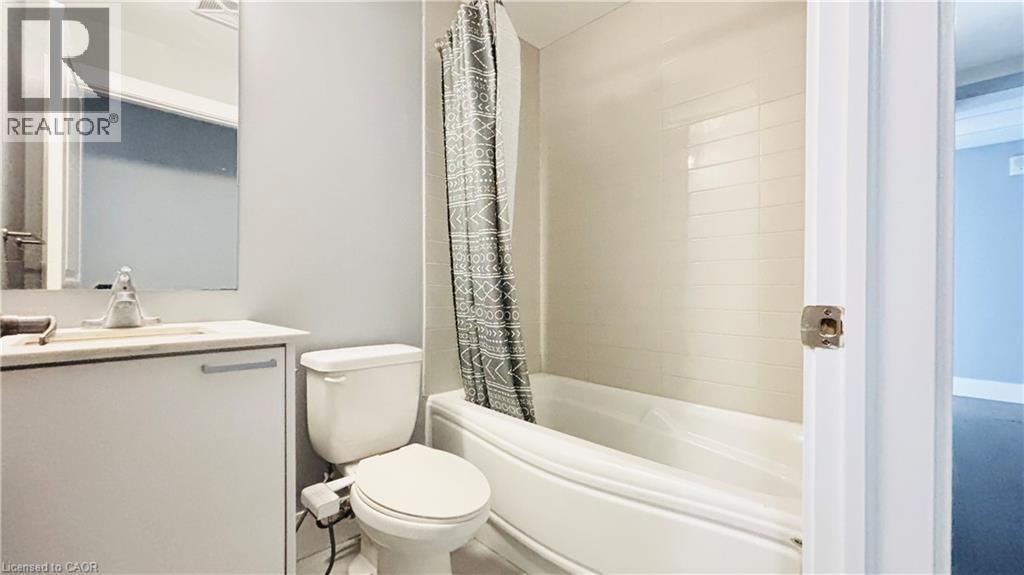 Bathroom with vanity and shower / tub combo - 155 St. Leger Unit# 107, Kitchener, ON - Indoor Photo Showing Bathroom
