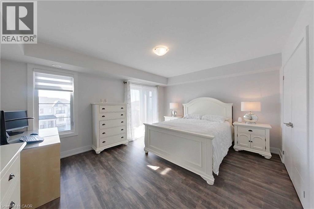 Bedroom with dark wood-style flooring - 588 Rapids Lane, Mississauga, ON - Indoor Photo Showing Bedroom