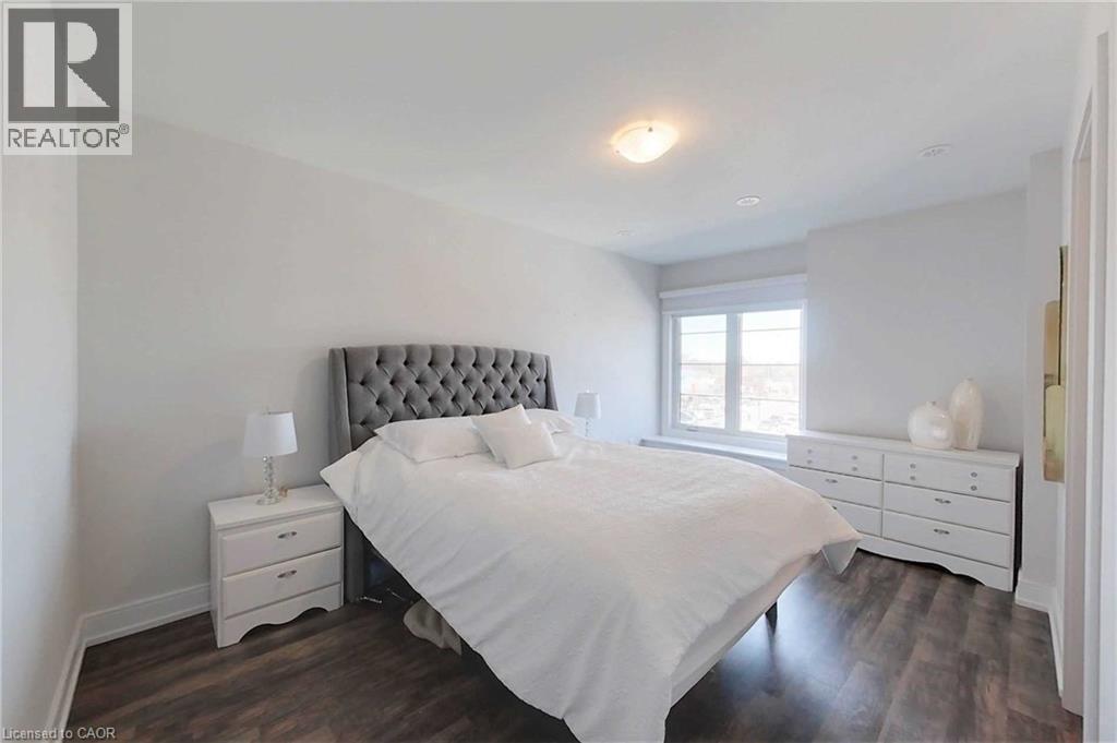 Bedroom featuring dark wood-type flooring - 588 Rapids Lane, Mississauga, ON - Indoor Photo Showing Bedroom