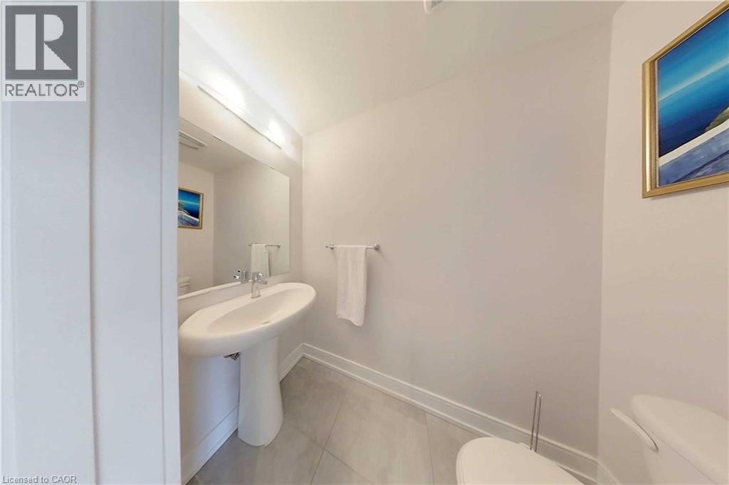 Bathroom featuring toilet and light tile patterned floors - 588 Rapids Lane, Mississauga, ON - Indoor Photo Showing Bathroom