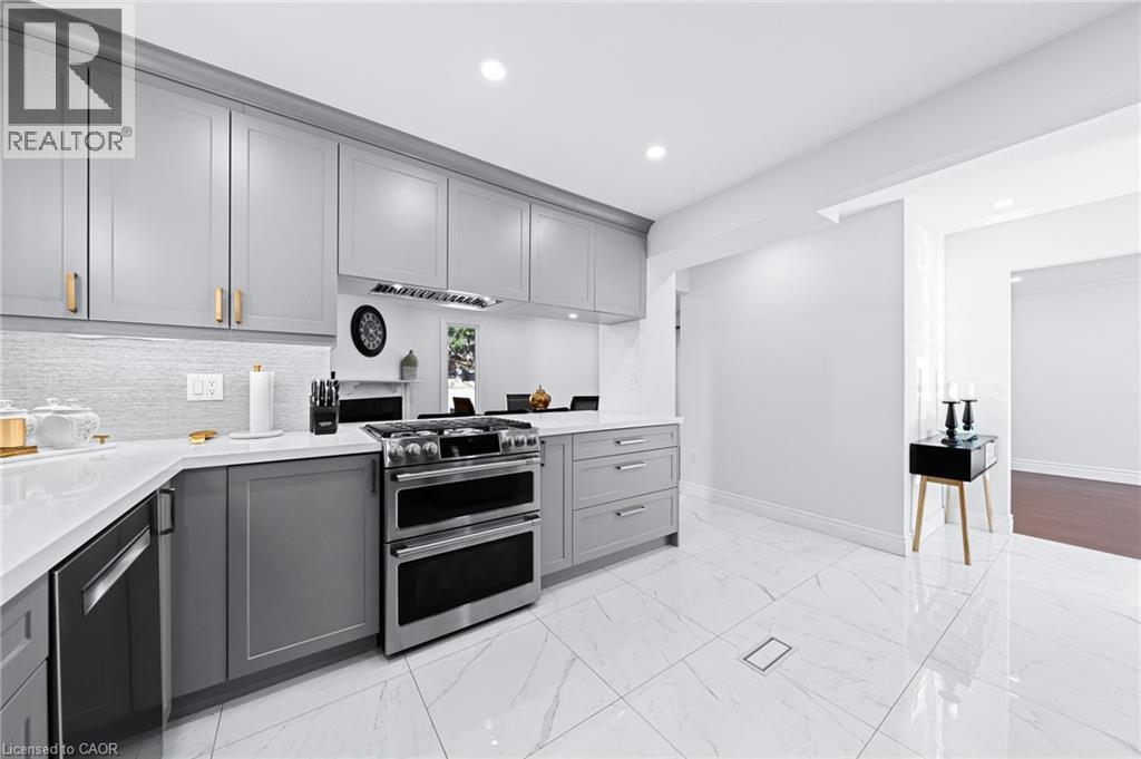 modern stainless steal appliances and plenty of storage space - 46 Novoco Drive, Hamilton, ON - Indoor Photo Showing Kitchen With Upgraded Kitchen