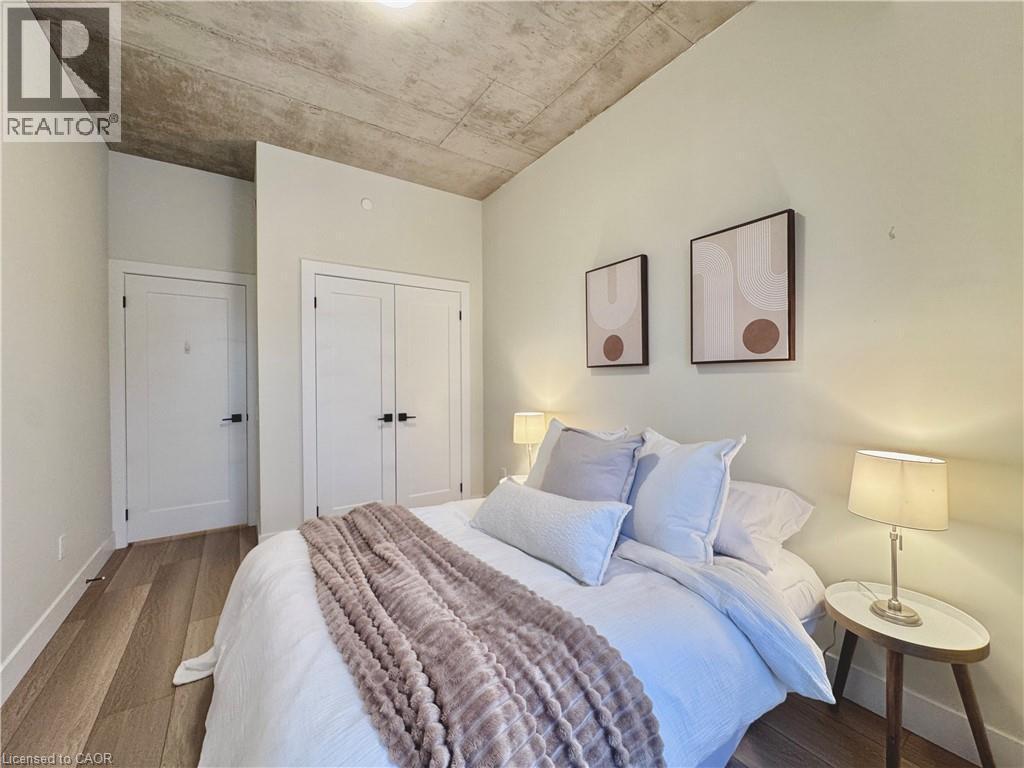 LARGE CLOSET IN PRIMARY BEDROOM - 169 James Street S Unit# 401, Hamilton, ON - Indoor Photo Showing Bedroom