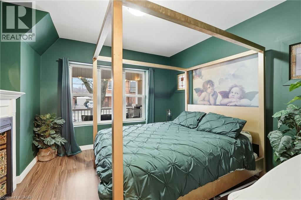 305 Cannon Street E, Hamilton, ON - Indoor Photo Showing Bedroom With Fireplace