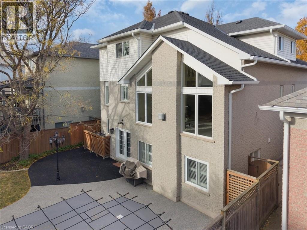 Back of property with a fenced backyard, a patio, and roof with shingles - 90 Westlawn Drive, Hamilton, ON - Outdoor With Exterior