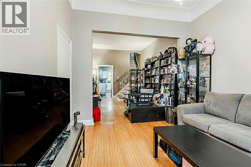 Living area with stairs and light wood-style floors - 172 Markland Street, Hamilton, ON - Indoor