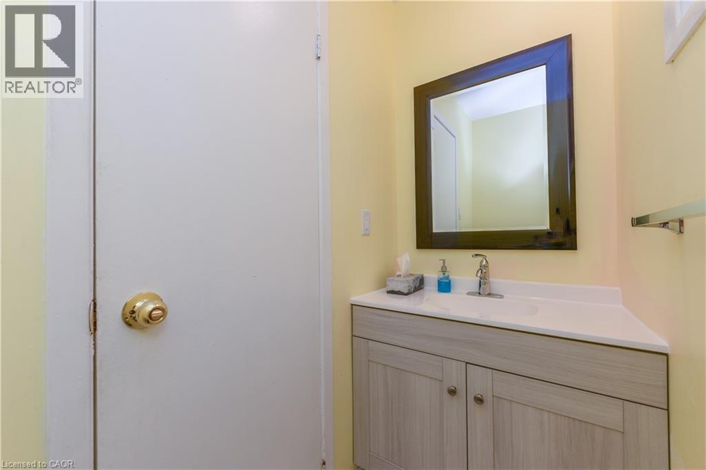 Half bathroom with vanity - 85 Enmount Drive, Brampton, ON - Indoor Photo Showing Bathroom
