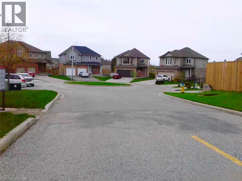 View of asphalt street featuring curbs and a residential view - 212 Westfield Place, Waterloo, ON - Outdoor