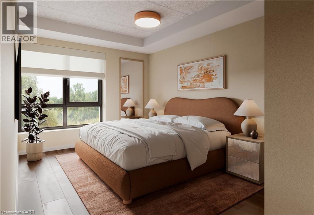 Bedroom featuring wood finished floors and baseboards - 580 Coldstream Drive Unit# 212, Waterloo, ON - Indoor Photo Showing Bedroom