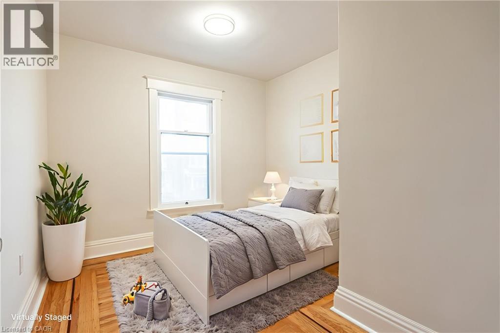 virtually staged - 17 Barnesdale Avenue N, Hamilton, ON - Indoor Photo Showing Bedroom