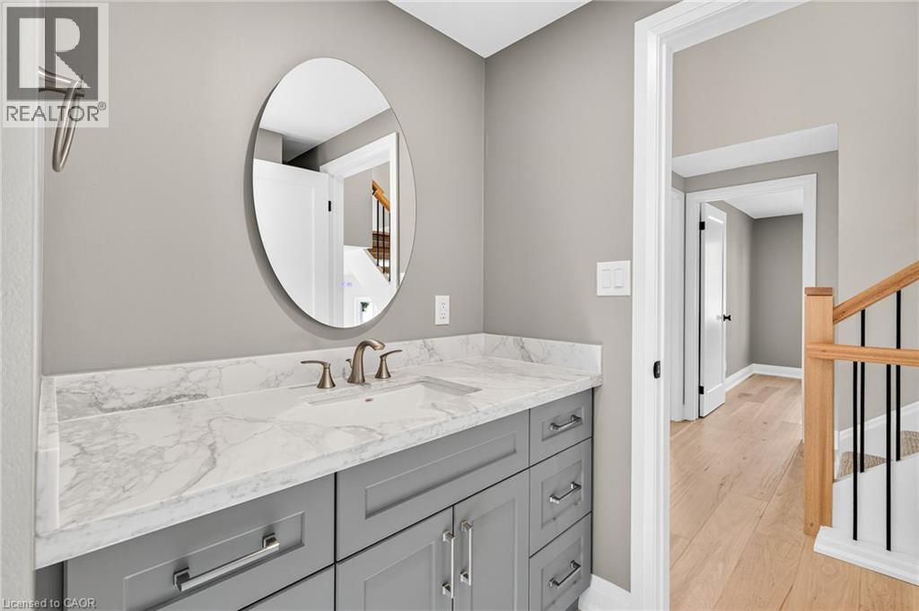 Bathroom with vanity and light wood-style floors - 4006 Flemish Drive, Burlington, ON - Indoor Photo Showing Bathroom