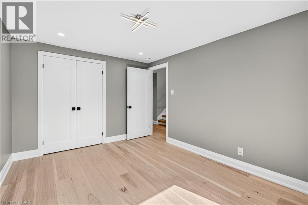 Unfurnished bedroom with light wood-style floors, recessed lighting, and a closet - 4006 Flemish Drive, Burlington, ON - Indoor Photo Showing Other Room