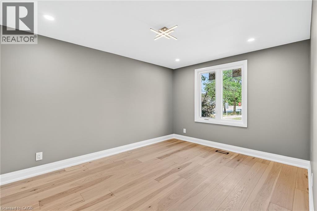 Spare room with light wood-type flooring and recessed lighting - 4006 Flemish Drive, Burlington, ON - Indoor Photo Showing Other Room