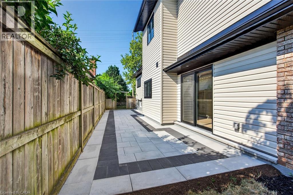 View of home's exterior with a patio area - 4006 Flemish Drive, Burlington, ON - Outdoor With Exterior