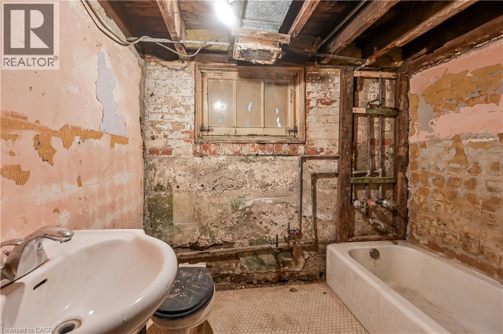Bathroom with a sink and a bathtub - 334 Cannon Street E, Hamilton, ON - Indoor Photo Showing Bathroom