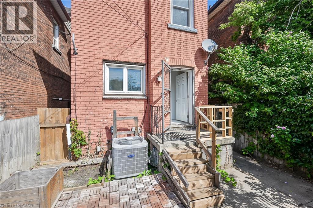 View of exterior entry featuring brick siding - 334 Cannon Street E, Hamilton, ON - Outdoor With Exterior