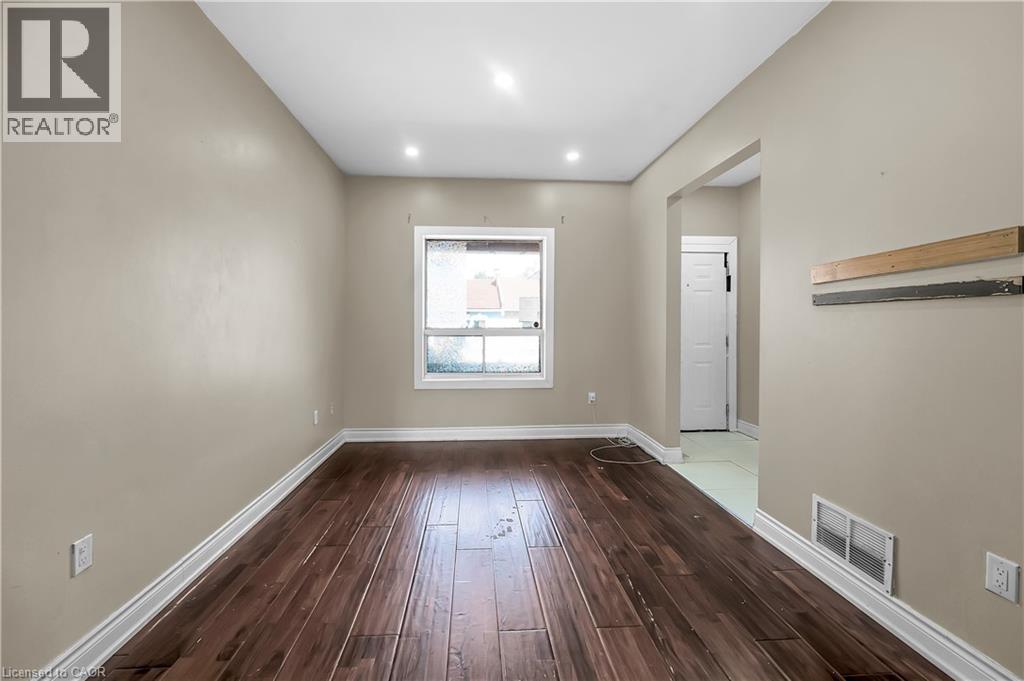 Spare room with wood-type flooring and recessed lighting - 334 Cannon Street E, Hamilton, ON - Indoor Photo Showing Other Room
