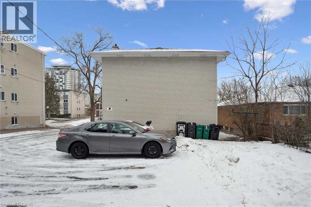View of snow covered parking area - 24 Austin Drive, Waterloo, ON - Outdoor
