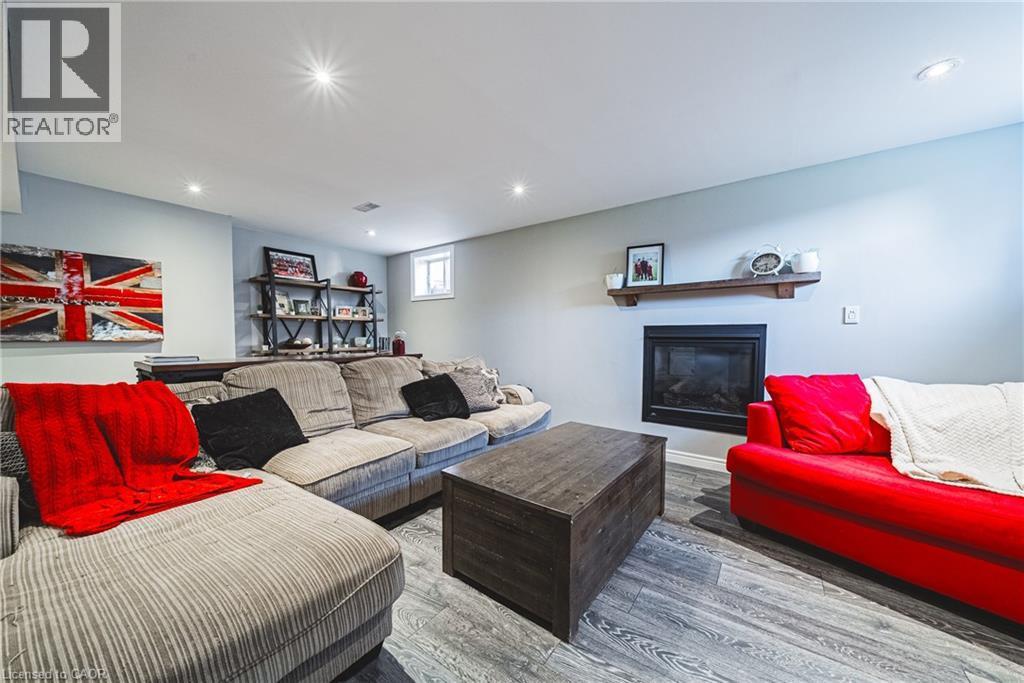 19 Liuna Court, Hamilton, ON - Indoor Photo Showing Living Room With Fireplace