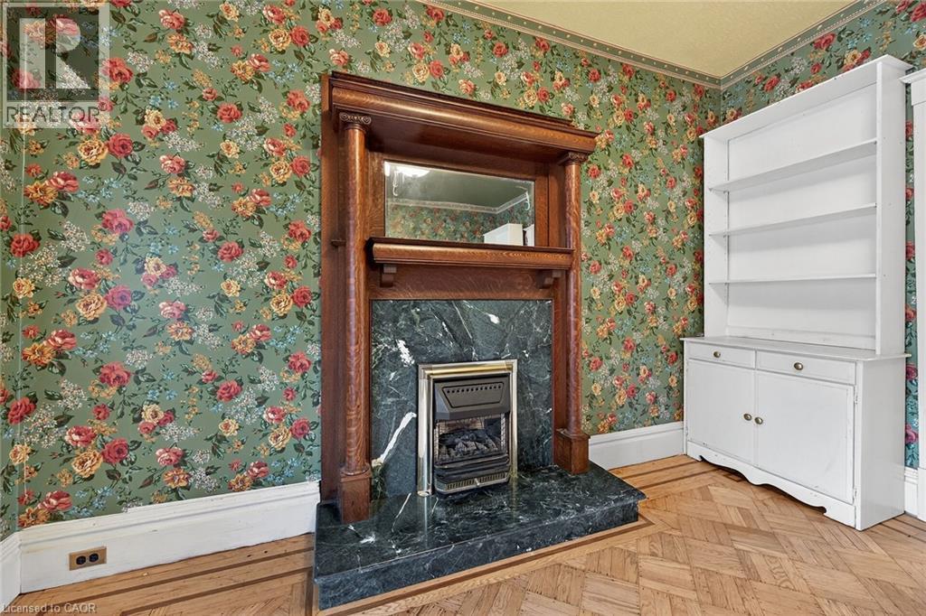 91 Spadina Avenue, Hamilton, ON - Indoor Photo Showing Other Room With Fireplace