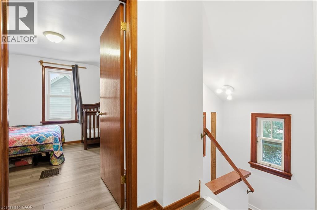 Corridor featuring an upstairs landing, healthy amount of natural light, light wood-style flooring, and vaulted ceiling - 157 Bridgeport Road E, Waterloo, ON - Indoor