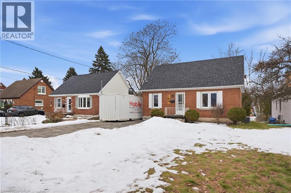 View of front of property featuring brick siding and roof with shingles - 157 Bridgeport Road E, Waterloo, ON - Outdoor