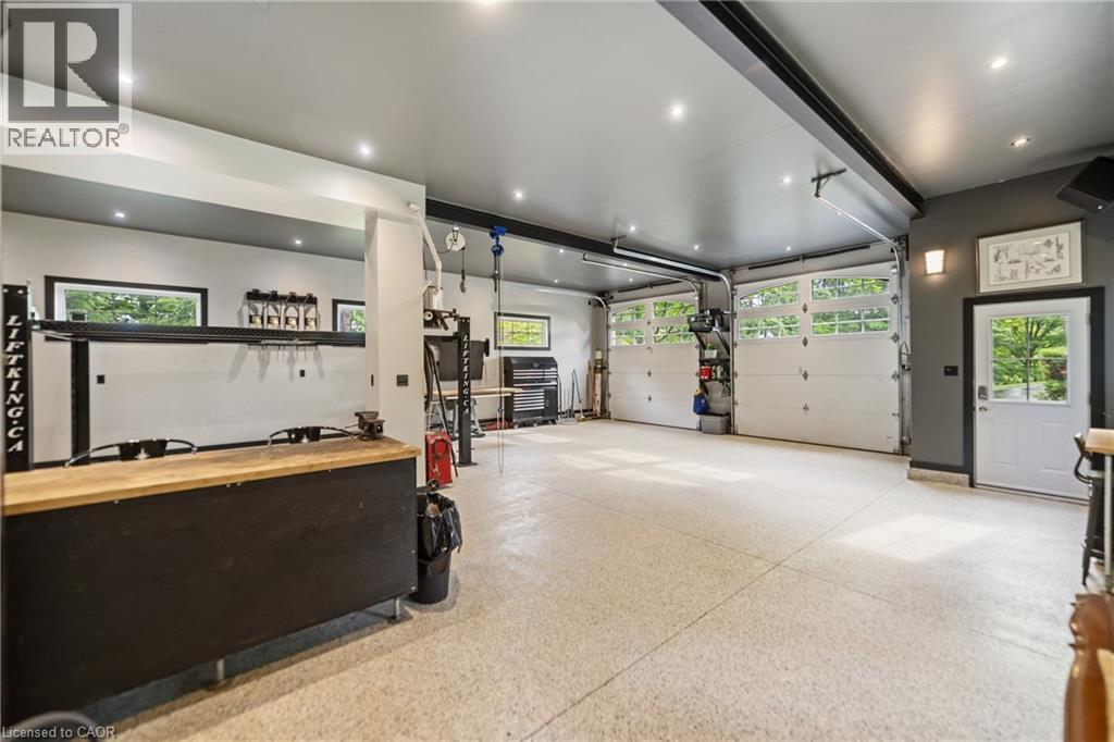 Detached garage featuring built in cabinetry, recessed lighting - 515 Hamilton Drive, Ancaster, ON - Indoor Photo Showing Garage