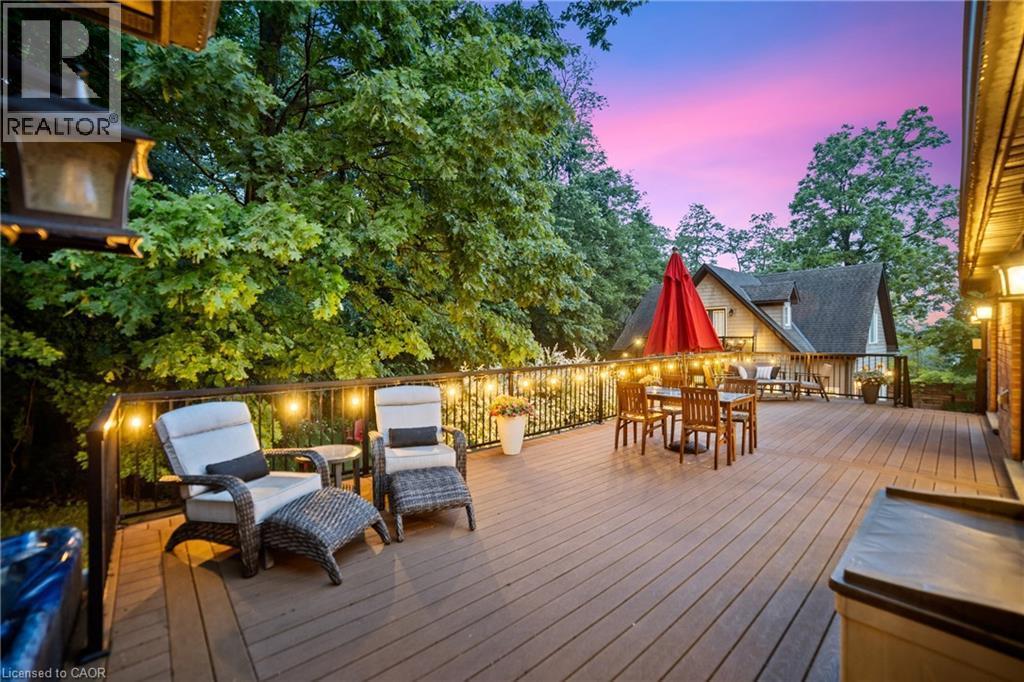 Expansive composite deck on main home is 40'x16' with foundation equipped to accommodate a covered porch , large outdoor dining area, off to the left is the hot tub (not shown) - 515 Hamilton Drive, Ancaster, ON - Outdoor With Deck Patio Veranda