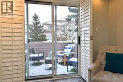 Doorway with plenty of natural light and wood finished floors -
