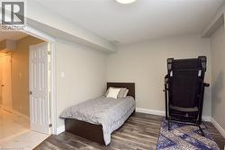 Bedroom with wood finished floors -