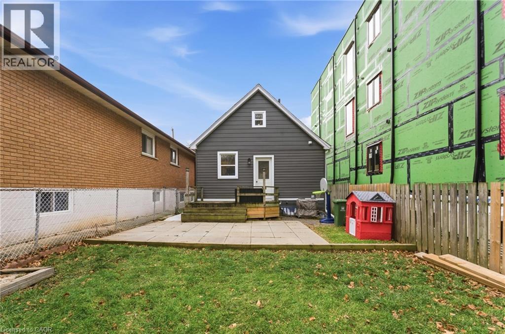 Back of property with a patio and a fenced backyard - 140 Royal Avenue, Hamilton, ON - Outdoor With Exterior