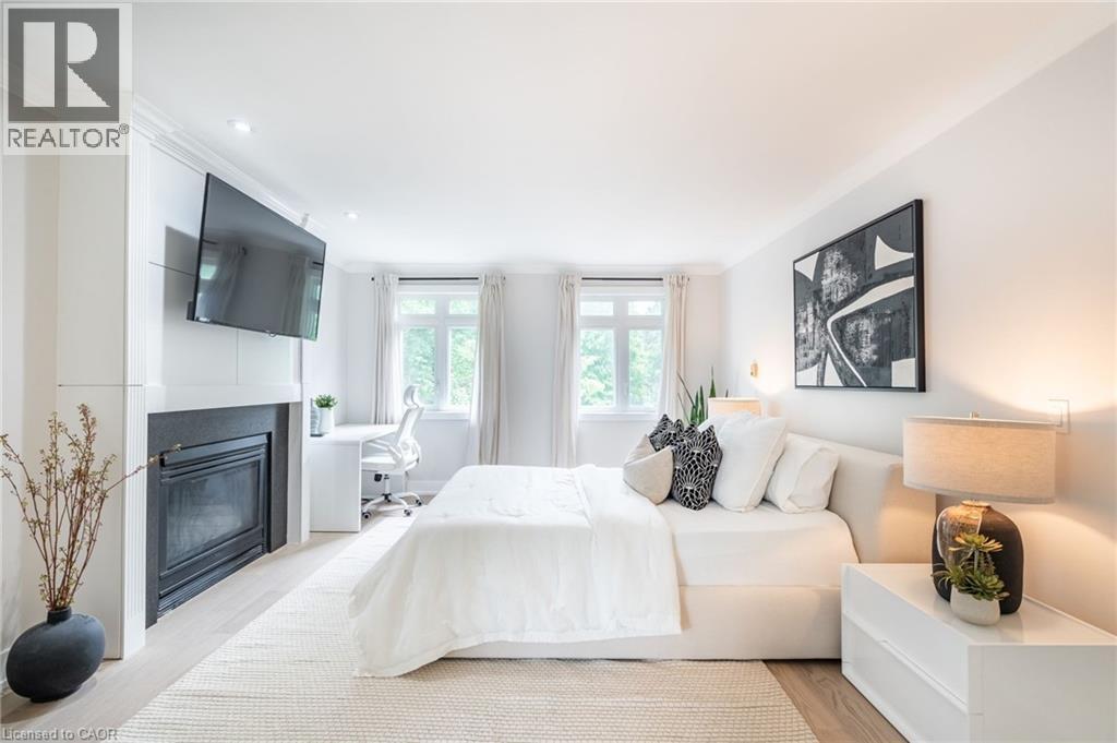 6618 Carriage Trail, Burlington, ON - Indoor Photo Showing Bedroom With Fireplace