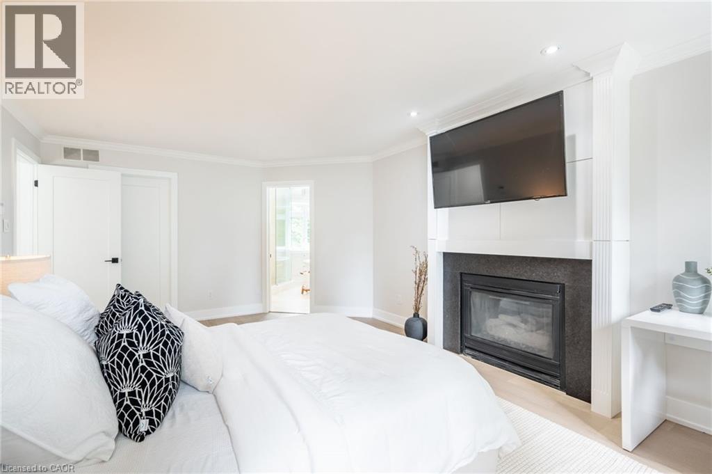 6618 Carriage Trail, Burlington, ON - Indoor Photo Showing Bedroom With Fireplace
