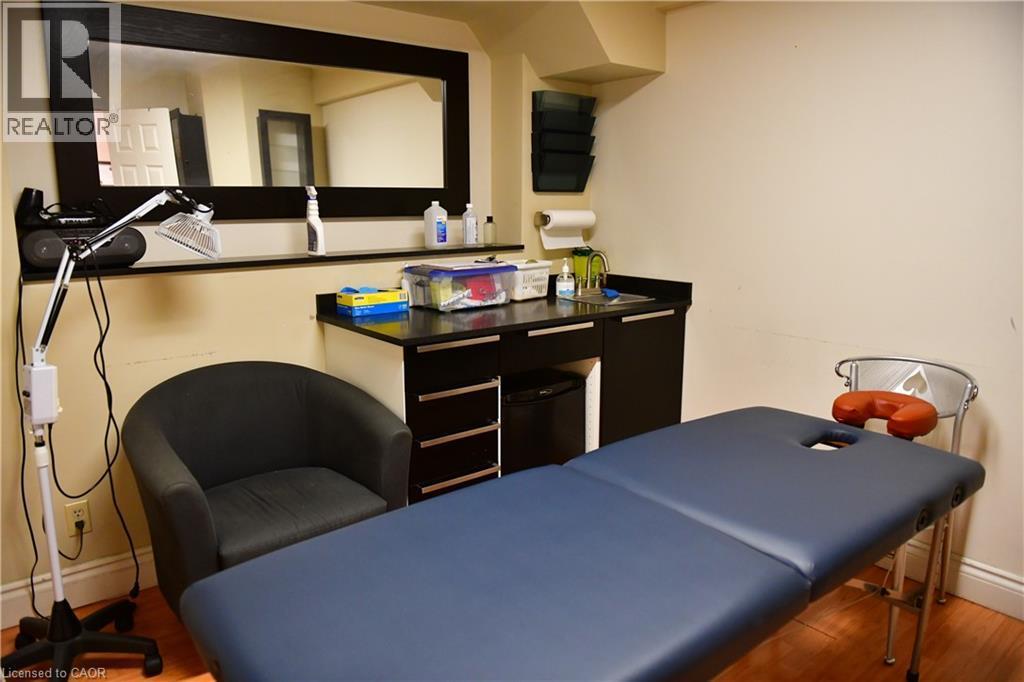 Home office featuring wood finished floors and baseboards - 265 Queen Street S, Mississauga, ON