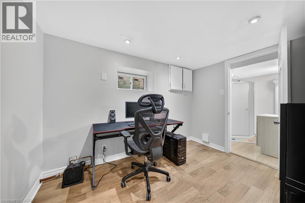 Home office featuring baseboards and light wood-type flooring - 421 East 36Th Street, Hamilton, ON - Indoor Photo Showing Office