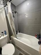 Full bath with shower / bath combo and toilet -