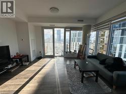 Living area featuring dark wood-type flooring -