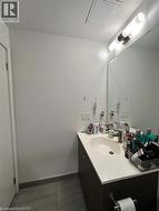 Bathroom with vanity and baseboards -