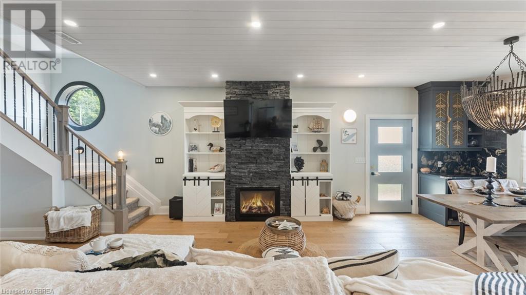33 Cedar Drive, Turkey Point, ON - Indoor Photo Showing Living Room With Fireplace