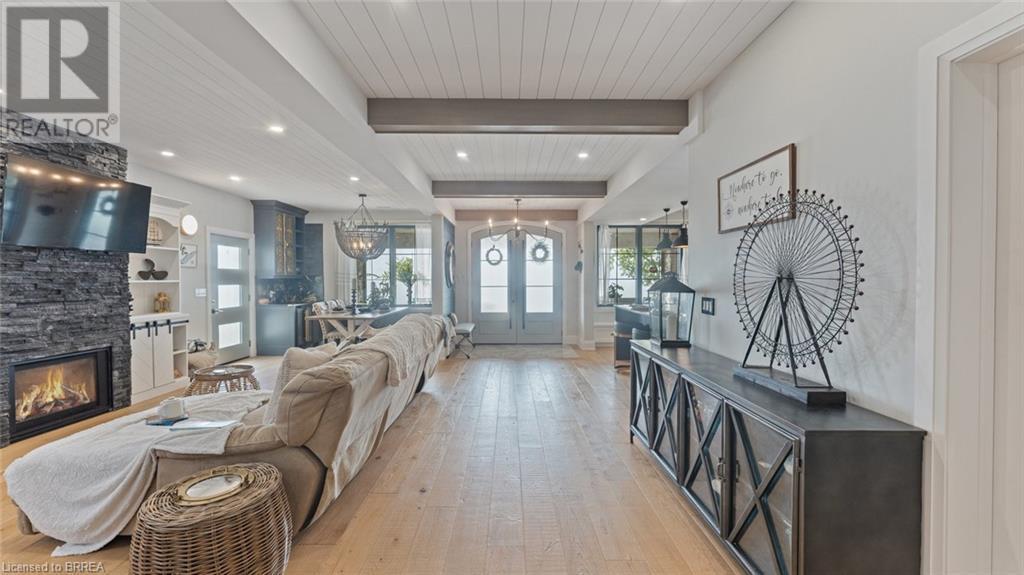 33 Cedar Drive, Turkey Point, ON - Indoor Photo Showing Other Room With Fireplace