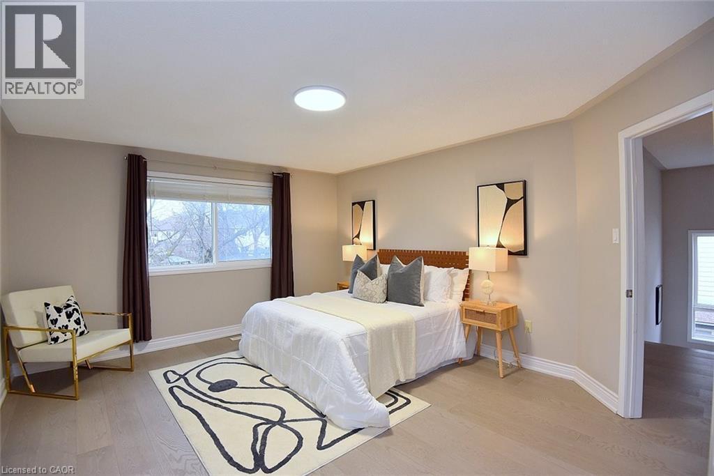 Bedroom with light wood-style floors and baseboards - 5109 Blue Spruce Avenue, Burlington, ON - Indoor Photo Showing Bedroom