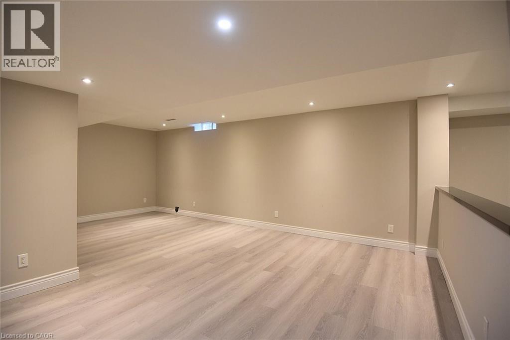 Finished below grade area featuring recessed lighting and light wood-type flooring - 5109 Blue Spruce Avenue, Burlington, ON - Indoor Photo Showing Other Room
