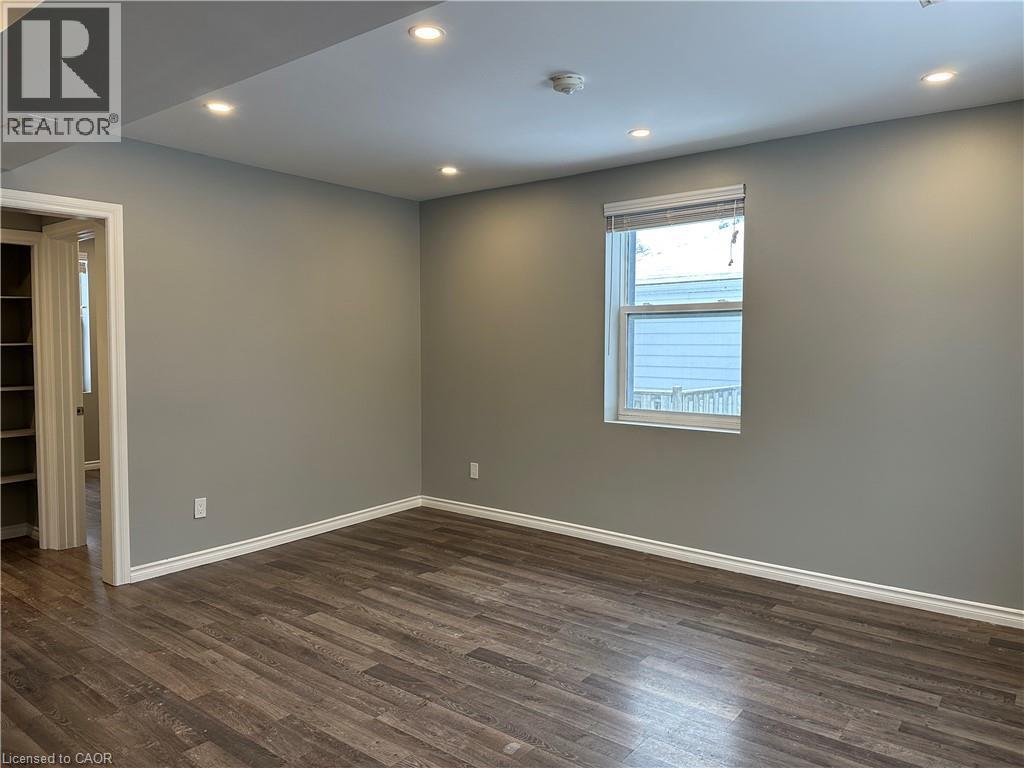 Spare room featuring dark wood-type flooring and recessed lighting - 80 Glen Road Unit# Upper, Kitchener, ON - Indoor Photo Showing Other Room
