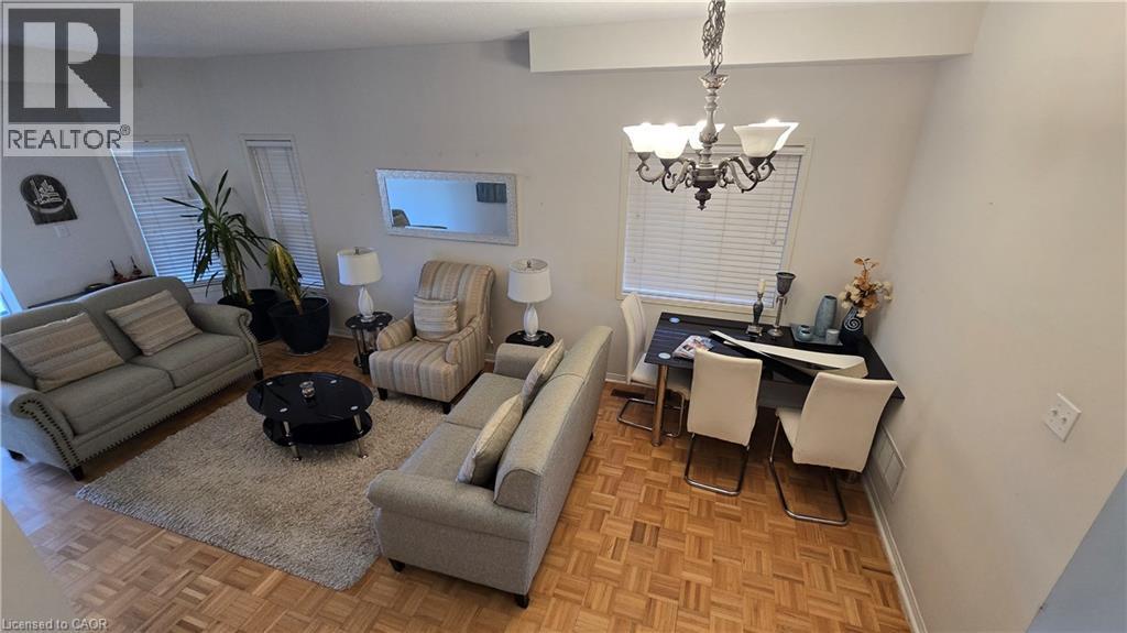 Living room featuring a chandelier and baseboards - 3688 Emery Drive, Mississauga, ON - Indoor Photo Showing Other Room